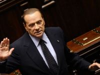 
	Berlusconi vrea sa schimbe soarta Italiei. Roubini: Fostul premier si puternice interese de afaceri vor revenirea tarii la lira
