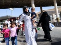 Peste 2 milioane de sirieni si-au parasit tara din cauza violentelor de la Damasc