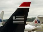 Cea mai mare companie aeriana din lume se naste greu. Parafarea fuziunii dintre American Airlines si US Airways, amanata