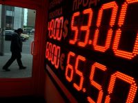 
	Banca centrala a Rusiei a intervenit din nou pe piata, cu 700 mil. dolari, dupa trecerea la flotarea libera a rublei
