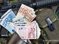 
	Bancnota euro care ar putea fi interzisa in UE. Modul in care hartiile &ldquo;bin Laden&rdquo; trec prin Romania si ajung la teroristi
