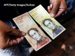 Maduro își face monedă virtuală, pentru a lupta împotriva blocadei financiare a SUA . Unele agenții de rating consideră Venezuela în default parțial